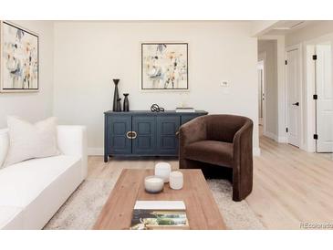 Bright living room featuring stylish decor, modern furniture, and an open layout perfect for entertaining at 3728 W Exposition Ave, Denver, CO 80219