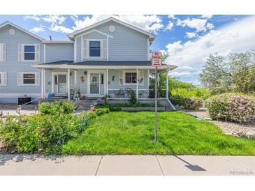 Charming home with curb appeal, featuring well-maintained landscaping and a welcoming entrance at 6260 Everett Ct # D, Arvada, CO 80004