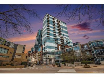 Beautiful exterior of modern high-rise condominium building with glass facade and striking architectural design at 1700 Bassett St # 802, Denver, CO 80202
