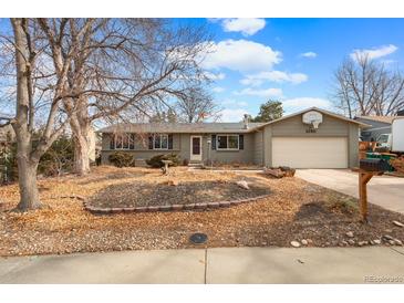 Charming single-story home featuring a two-car garage and a well-maintained front yard at 3280 S Ouray Way, Aurora, CO 80013