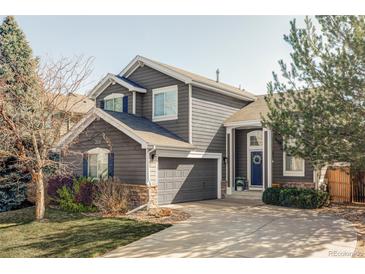 Charming two-story home featuring a well-manicured lawn and a welcoming entrance at 4128 S Riviera St, Aurora, CO 80018
