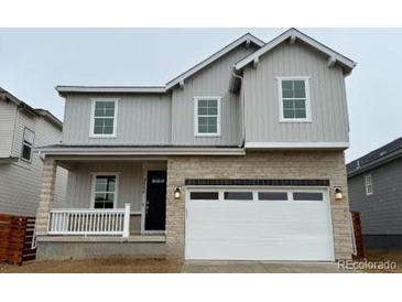 Charming two-story home featuring a modern elevation and two-car garage at 3352 N Buchanan Way, Aurora, CO 80019