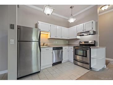 Modern kitchen featuring stainless steel appliances and white cabinetry at 3233 Vallejo St # 3B, Denver, CO 80211