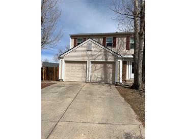 Charming two-story home featuring a two car garage and traditional shutters at 16835 E Harvard Pl, Aurora, CO 80013