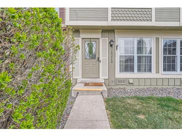 Inviting front entrance with well-maintained landscaping and a decorative door at 14344 E Hawaii Cir # B, Aurora, CO 80012