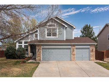 Charming two-story home with a two-car garage, mature trees, and well-maintained landscaping at 12742 Vrain St, Broomfield, CO 80020
