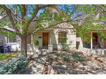 Charming home featuring a manicured front yard and a welcoming entryway at 1529 E 22Nd Ave, Denver, CO 80205