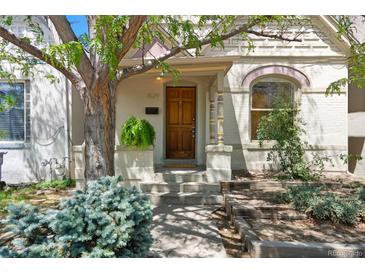 Close-up of a front exterior showcasing a well-kept yard and inviting entrance at 1529 E 22Nd Ave, Denver, CO 80205