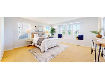 Bright main bedroom with a large window seat and neutral tones at 7932 E 49Th Pl, Denver, CO 80238