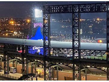 Night view of the Rockies ballpark showing the field and stadium lights at 1901 Wazee St # 707, Denver, CO 80202