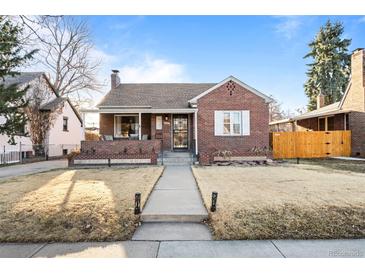 Charming brick home features a covered porch, landscaped front yard and sidewalk to street at 1429 Hudson St, Denver, CO 80220