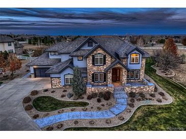 Stunning two-story home with stone accents and a landscaped yard at 15102 Prairie Pl, Broomfield, CO 80023