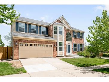 Charming two-story brick home with a well-manicured lawn and a spacious two car garage at 5674 S Ingalls St, Littleton, CO 80123