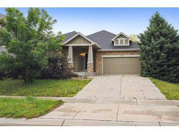 Charming single-Gathering home with a well-maintained lawn and a two-car garage at 179 N Prairie Falcon Pkwy, Brighton, CO 80601