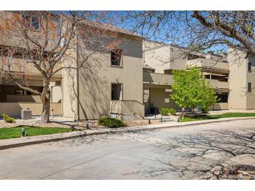A charming multi-level home featuring neutral colors, a well-kept lawn, and mature trees in a serene neighborhood at 2938 Kalmia Ave # 6, Boulder, CO 80301