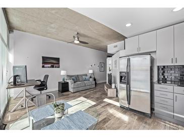 Stylish condo with exposed concrete ceilings, hardwood floors and modern furnishings at 1700 Bassett St # 820, Denver, CO 80202