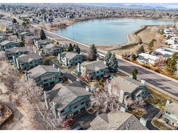 Aerial view of townhouses near a lake, showcasing the community and its location at 10280 W Jewell Ave # B, Lakewood, CO 80232