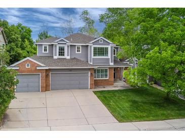 Charming two-story home featuring a well-manicured front yard and attached two-car garage at 2204 Lasalle St, Superior, CO 80027