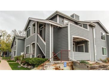 Inviting two-story home featuring well-maintained siding and manicured landscaping in a charming community at 8500 E Jefferson Ave # 7B, Denver, CO 80237