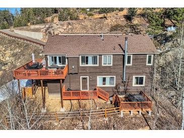 Charming mountain home with multiple decks and a hot tub at 10197 Crest View Dr, Morrison, CO 80465