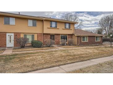 Charming townhome with a well-maintained front yard and inviting entrance, perfect for first-time homebuyers at 12407 E Louisiana Ave, Aurora, CO 80012