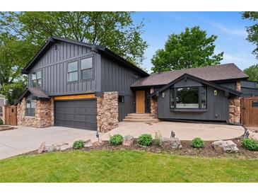Charming two-story home with a stylish gray exterior, stone accents, and a well-manicured front yard at 4269 Carter Trl, Boulder, CO 80301