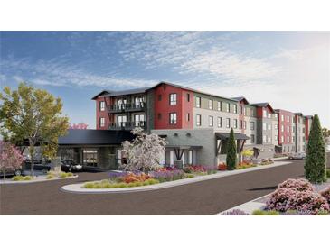 Striking multi-story exterior with colorful siding, covered entrance and manicured landscaping at 12983 W Ida Ave # 304, Littleton, CO 80127