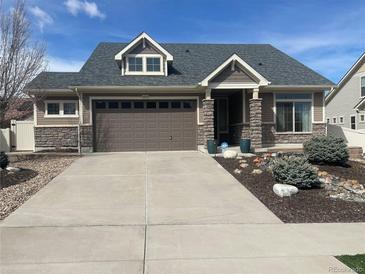 Charming single-Gathering home with a well-maintained lawn and inviting curb appeal at 19753 E 54Th Ave, Denver, CO 80249