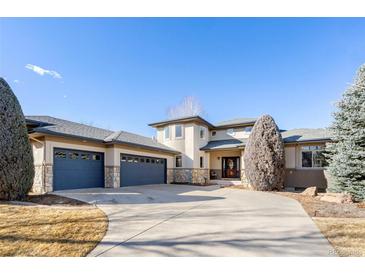 Stately home featuring a circular driveway and a three-car garage at 4405 Fairway Ln, Broomfield, CO 80023