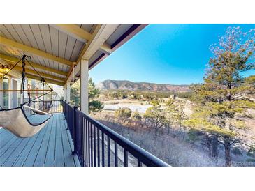 Enjoy this gorgeous deck with a hammock and stunning views at 6301 Perry Park Blvd # 22, Larkspur, CO 80118