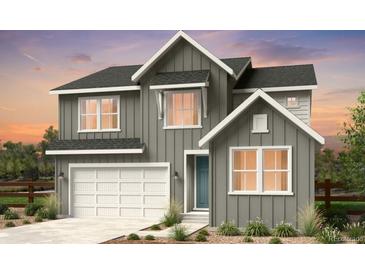 Two-story craftsman style home with gray siding and white trim at 4225 Ridgewalk Pt, Castle Rock, CO 80108