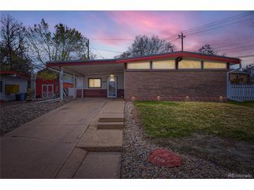 Charming single-story home showcasing a low-pitched roofline and a combination brick and siding facade at 5294 S Prescott St, Littleton, CO 80120