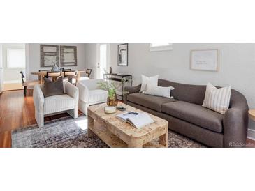 Cozy living room with stylish furniture and hardwood floors for a comfortable and inviting space at 1025 E Iowa Ave, Denver, CO 80210
