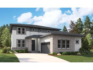 Two-story home with gray and white siding, attached garage, and landscaping at 1141 Joseph Pl, Erie, CO 80026