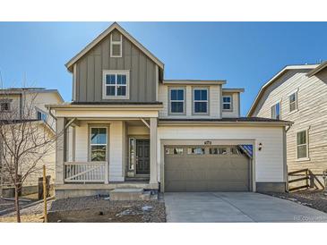 Charming two-story home featuring a welcoming front porch and an attached two-car garage at 5546 Inland Ave, Firestone, CO 80504