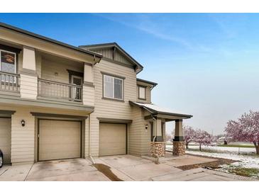 Inviting townhome with attached garages, stone accents, and manicured landscaping, offering convenience and curb appeal at 12914 Grant Cir # C, Thornton, CO 80241