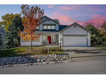 Two-story house with attached garage and landscaping at 5123 Red Oak Way, Parker, CO 80134