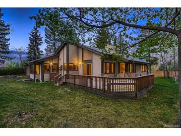 Charming home featuring an expansive deck, perfect for outdoor living and entertaining at 900 Poplar Ave, Boulder, CO 80304