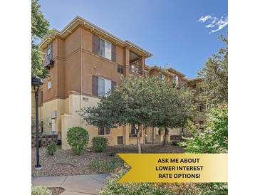 Attractive condo building with well-maintained landscaping and a private outdoor space at 803 E 98Th Ave # 105, Thornton, CO 80229