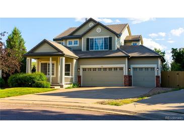 Charming two-story home with a well-maintained front yard and three car garage at 3232 Cimarron Pl, Superior, CO 80027
