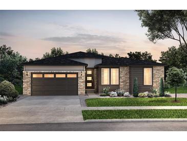 Charming single-story home featuring stone accents, a two-car garage, and a well-manicured front yard at 4114 N Duquesne Ct, Aurora, CO 80019