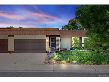 Charming single-story home with a landscaped front yard and attached garage, radiating curb appeal at 1490 S Salem Way, Aurora, CO 80012