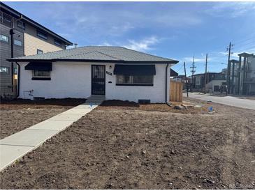 Charming brick home with a newly landscaped front yard and inviting entryway at 2000 Irving St, Denver, CO 80211