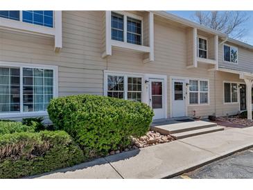 Charming townhome with a well-maintained facade, natural light, and lush landscaping at 8905 Field St # 91, Westminster, CO 80021