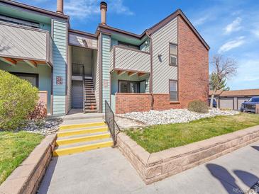 Attractive condo with brick accents, multiple balconies and nicely landscaped grounds at 11985 E Harvard Ave # 108, Aurora, CO 80014