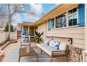 Charming patio with stylish seating, perfect for outdoor relaxation and entertaining guests at 3127 And 3125 N Raleigh St, Denver, CO 80212