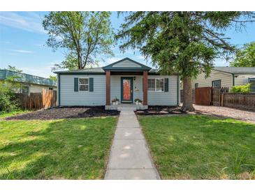 Charming home featuring a well-manicured lawn and inviting walkway at 2080 Fulton St, Aurora, CO 80010
