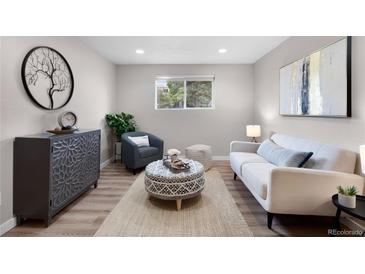 Cozy living room features modern decor, wood floors, and bright natural light at 16359 W 10Th Ave # T1, Golden, CO 80401