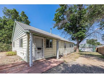 Charming single-story home with a well-maintained exterior, mature trees, and a welcoming entrance at 444 S Jersey St, Denver, CO 80224