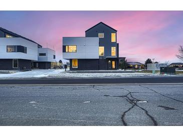 Striking contemporary home with clean lines, modern design, and vibrant twilight sky at 10193 W 38Th Ave, Wheat Ridge, CO 80033